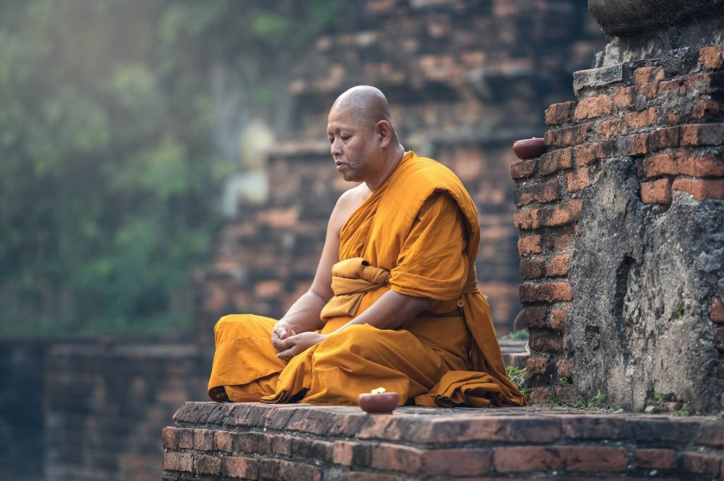 Do Psychedelics Manifest Synchronicities via the Collective Unconscious? 75 Buddhist monk meditating to reach ultimate reality